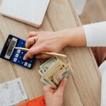 person tracking expenses and saving money