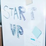 Creative startup concept handwritten on a whiteboard, symbolizing innovation in business.