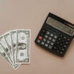 A signpost illustrating different debt repayment strategies leading to financial freedom.