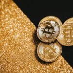 A visual representation of real-world assets in crypto showing tokenized gold and real estate on a blockchain.