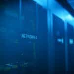 A modern server room featuring network equipment with blue illumination. Ideal for technology themes.